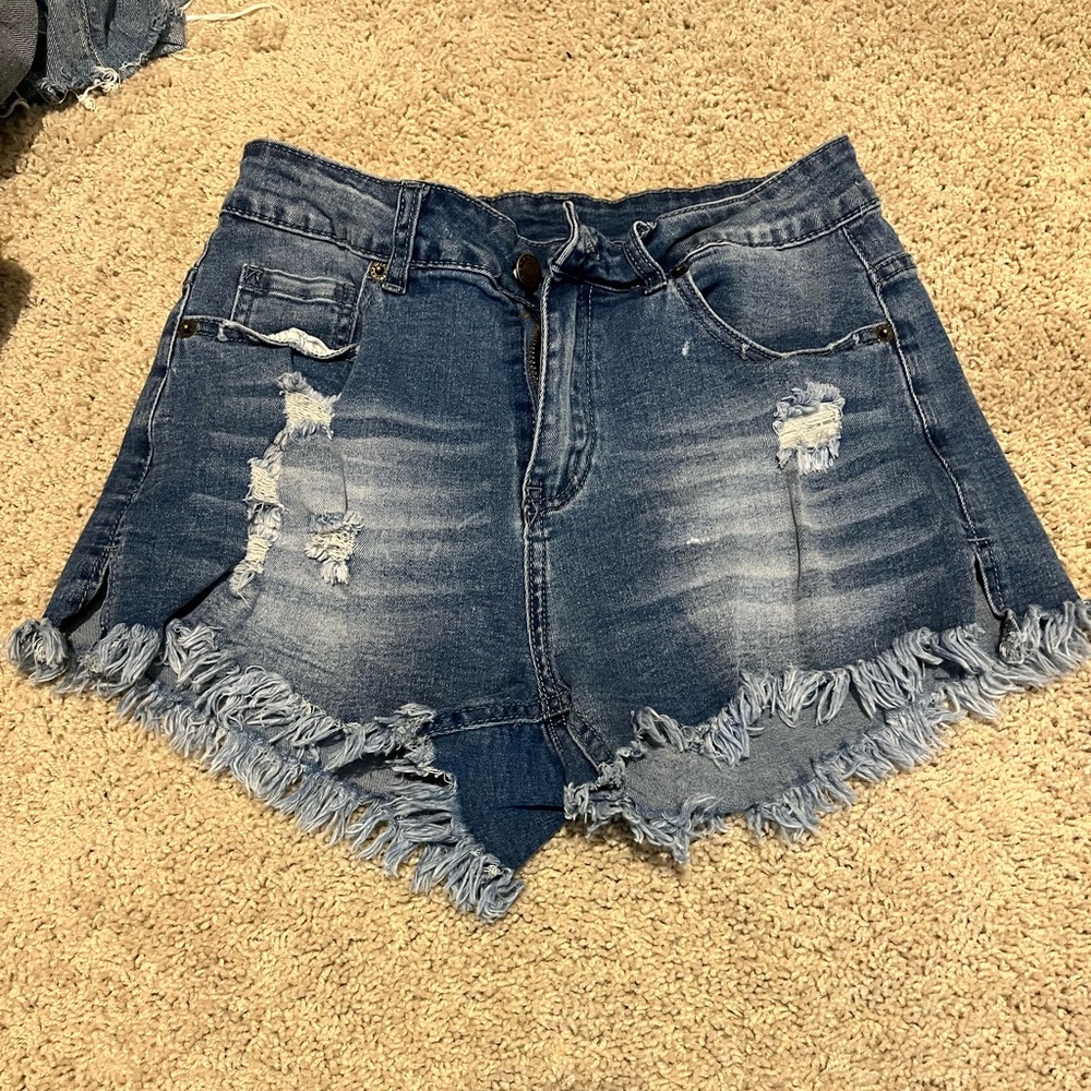 Super cute distressed jean shorts. Stretchy. Size Medium, fits like Small